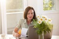 Attractive young woman working from home studying using laptop Royalty Free Stock Photo