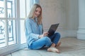 Attractive young woman working with laptop at home Royalty Free Stock Photo