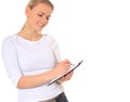 Attractive young woman writing on clipboard Royalty Free Stock Photo