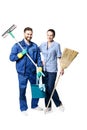 Attractive young woman and man in cleaning uniform and rubber gloves holding a broom cleaning products in his hands Royalty Free Stock Photo
