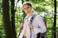 Attraktive young woman hiking as a backpacker in forest Royalty Free Stock Photo