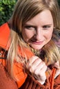 Attrative woman with warming waistcoat in autumn