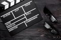 Attributes of film director. Movie clapperboard and sunglasses o