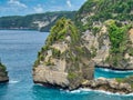 Atuh Beach is a Rustic, isolated cove beneath a sheer cliff face, with a sandy beach offshore rock formations Royalty Free Stock Photo