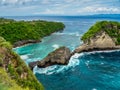 Atuh Beach is a Rustic, isolated cove beneath a sheer cliff face, with a sandy beach offshore rock formations Royalty Free Stock Photo