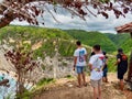 Atuh Beach is a Rustic, isolated cove beneath a sheer cliff face, with a sandy beach offshore rock formations