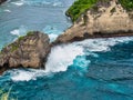 Atuh Beach is a Rustic, isolated cove beneath a sheer cliff face, with a sandy beach offshore rock formations Royalty Free Stock Photo