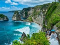 Atuh Beach is a Rustic, isolated cove beneath a sheer cliff face, with a sandy beach offshore rock formations Royalty Free Stock Photo