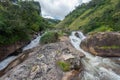 Atukkad Waterfalls near Munnar in Kerala, South India on cloudy day in rain season Royalty Free Stock Photo