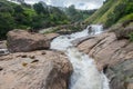 Atukkad Waterfalls near Munnar in Kerala, South India on cloudy day in rain season Royalty Free Stock Photo