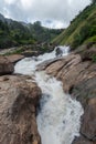 Atukkad Waterfalls near Munnar in Kerala, South India on cloudy day in rain season Royalty Free Stock Photo