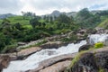 Atukkad Waterfalls near Munnar in Kerala, South India on cloudy day in rain season Royalty Free Stock Photo