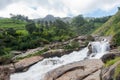 Atukkad Waterfalls near Munnar in Kerala, South India on cloudy day in rain season Royalty Free Stock Photo