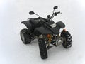ATV Black All Terrain Vehicle on white snow Royalty Free Stock Photo
