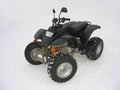 ATV Black All Terrain Vehicle on white snow Royalty Free Stock Photo