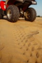 Atv in desert, closeup view on tread marks, nobody Royalty Free Stock Photo