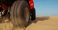 Atv in desert, closeup view on wheel, nobody Royalty Free Stock Photo