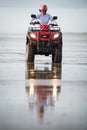 ATV driver on the beach Royalty Free Stock Photo