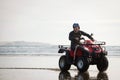 ATV driver on the beach Royalty Free Stock Photo