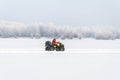 ATV driving on a snowy highway. Royalty Free Stock Photo