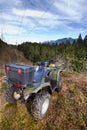 ATV parked overlooking forest