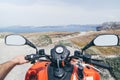 ATV quad bike driving along the shore of Aegean sea on Santorini island, Greece Royalty Free Stock Photo