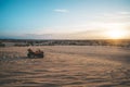ATV Quad Bike in front of sunrise in the desert. ATV stands in the sand on a sand dune in the desert of Vietnam. MUI ne Royalty Free Stock Photo