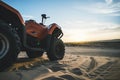 ATV Quad Bike in front of sunrise in the desert. ATV stands in the sand on a sand dune in the desert of Vietnam. MUI ne Royalty Free Stock Photo