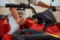 Atv racer in desert, closeup front view on hands Royalty Free Stock Photo