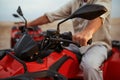 Atv racer in desert, closeup front view on hands Royalty Free Stock Photo