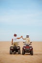 Atv racers in helmets, freedom riding in desert Royalty Free Stock Photo