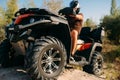 Atv rider climbing the sand mountain, back view Royalty Free Stock Photo