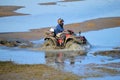 ATV Riding in Mud and Water Royalty Free Stock Photo