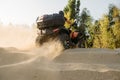 Atv riding in sand quarry, dust clouds, quad bike Royalty Free Stock Photo