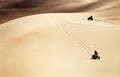 ATVs driving through desert sand dunes Royalty Free Stock Photo