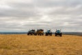 ATVs in the field in the highlands, on cloudy day