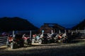 ATVs and motorcycles in the Parking lot at night with the stars in the summer