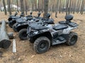 All-terrain vehicles for driving through the forest. Quad bike on the background of the forest. Four-wheeled vehicles for outdoor Royalty Free Stock Photo