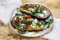 Aubergine with goat cheese and crispy kale Royalty Free Stock Photo