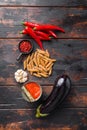 Aubergine penne ingredients eggplant pasta, pepper tomatoe sauce, on old wooden table top view Royalty Free Stock Photo