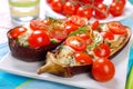 Aubergine stuffed with cherry tomato and mozzarella Royalty Free Stock Photo