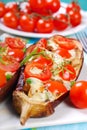 Aubergine stuffed with cherry tomato and mozzarella Royalty Free Stock Photo