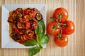 Aubergines in tomato sauce with fresh tomatoes