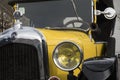 The old cars : Close-up of a yellow very old french car. It`a Citroen brand vehicle.