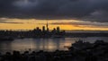 Auckland city in silhouette at dusk, view from Mt Victoria in Devonport