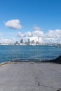 Auckland city skyline beyond Stanley Bay boat launching ramp and harbour Royalty Free Stock Photo