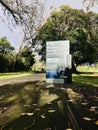 One of the entrance stand of Western Springs Lakeside Park, a man just walk in the park.