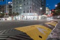 Night scene corner Queen and Victoria Streets passing traffic a