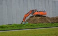 Kidd excavator on dirt pile