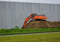 Kidd excavator on dirt pile